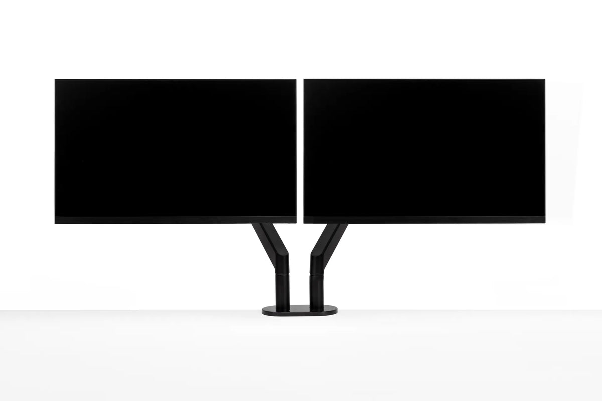 Two black monitors aligned side by side on a black dual monitor arm against a white background