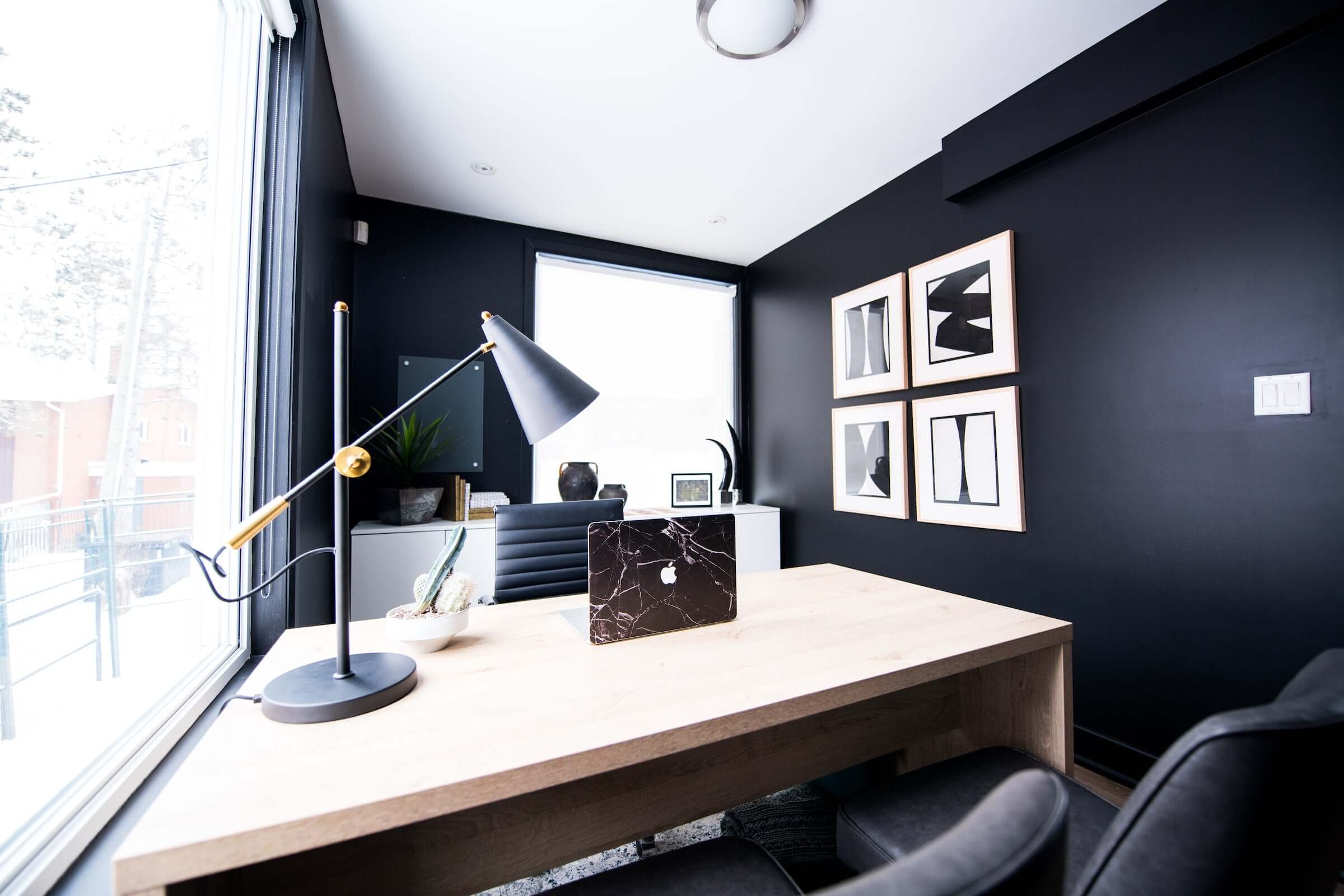 Compact office arranged with a desk, storage and natural light