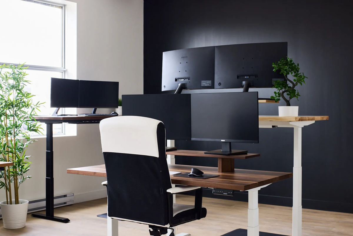 Showroom with several desk and chair configurations in contrasting finishes